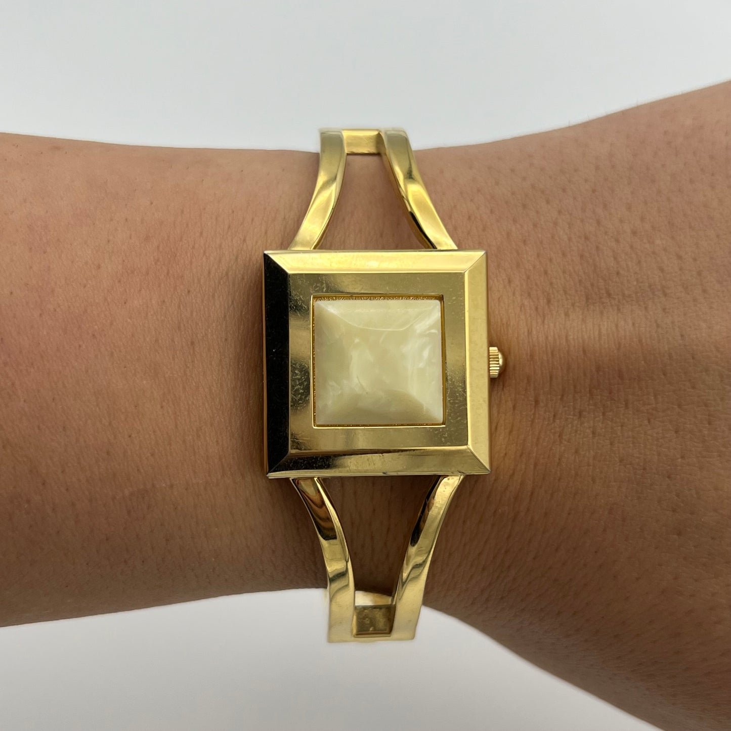 Gold-Toned Peek-a-boo Watch with White Stone