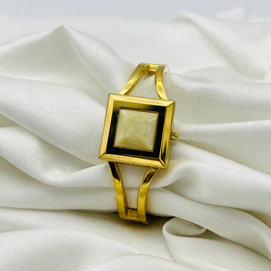 Gold-Toned Peek-a-boo Watch with White Stone