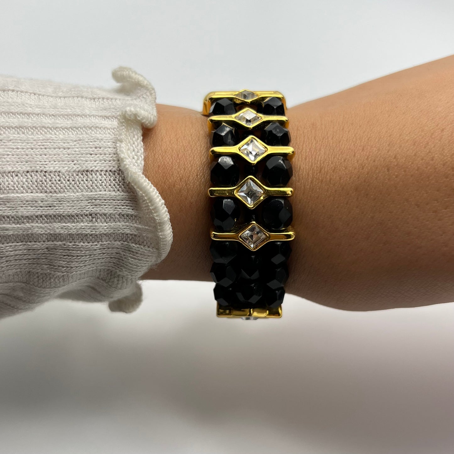 Gold-Toned Watch with Black Crystals