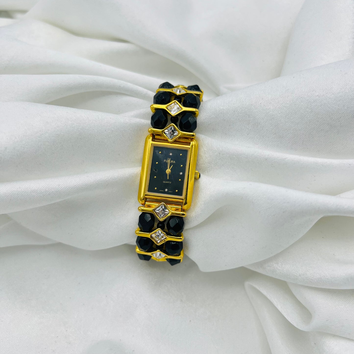 Gold-Toned Watch with Black Crystals