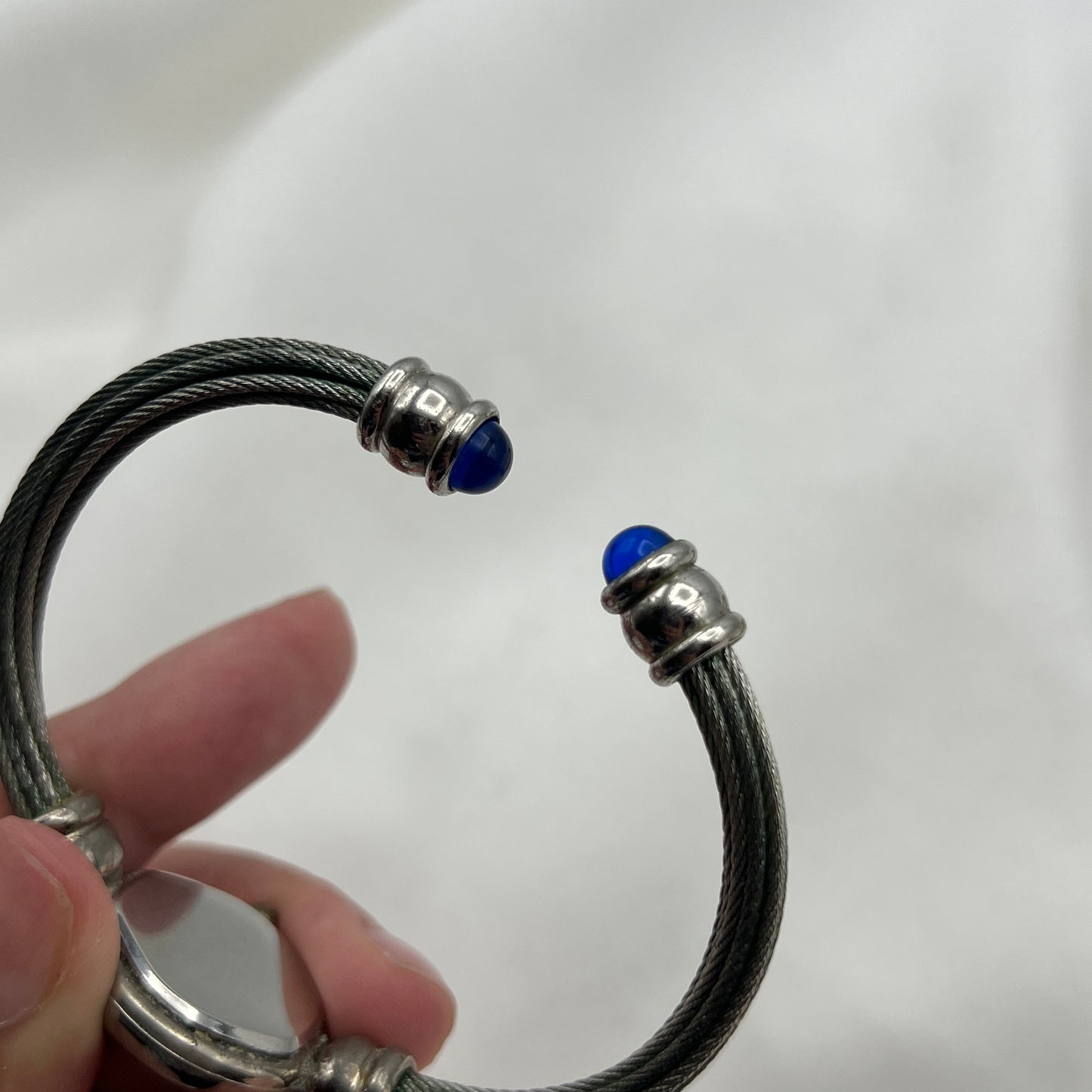Twisted Silver-Tone Watch with Blue Gem Details