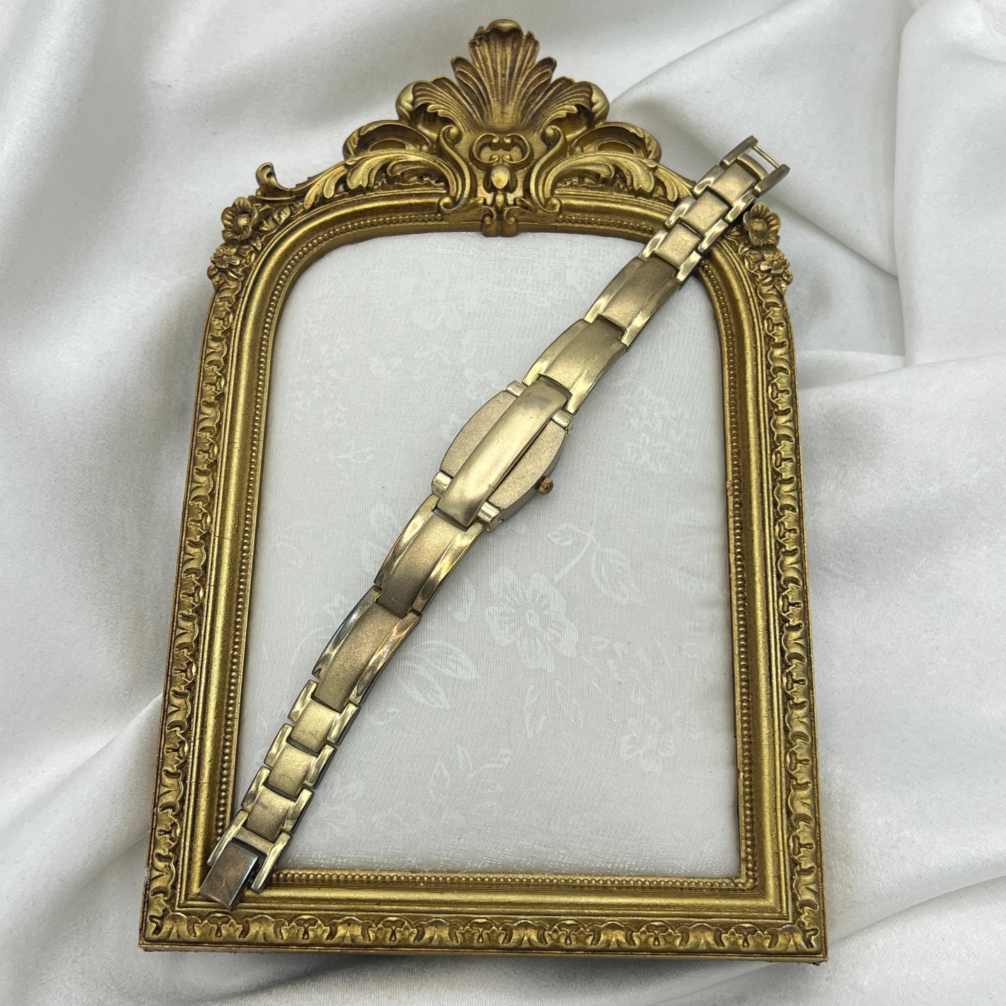 Gold Tone Peek a Boo Watch with Ruby Detailing
