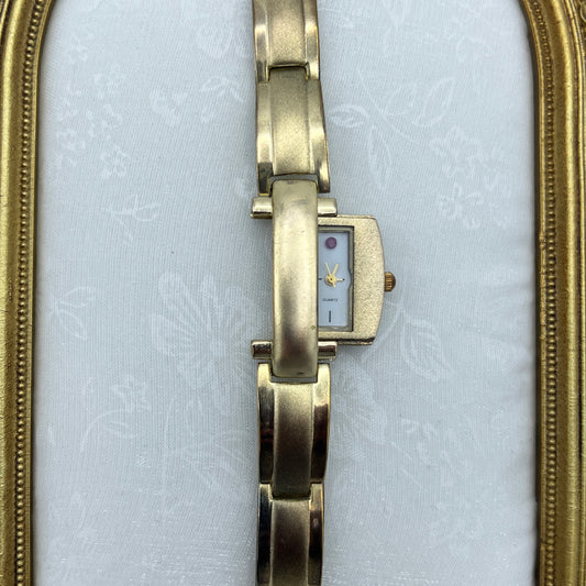 Gold Tone Peek a Boo Watch with Ruby Detailing