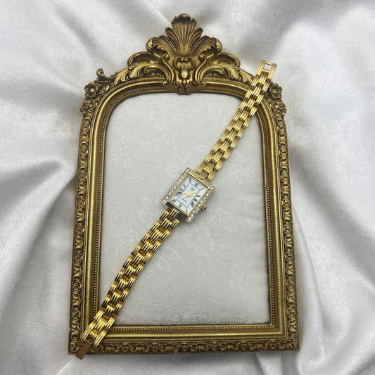 Elizabeth Taylor Gold-Toned Watch Similar to the Cartier Tank American. Price: ~$13,000