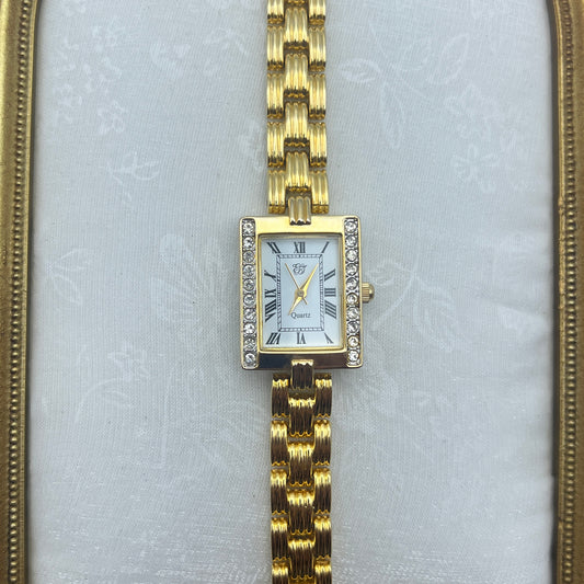 Elizabeth Taylor Gold-Toned Watch Similar to the Cartier Tank American. Price: ~$13,000