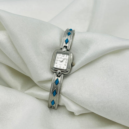 Dainty Silver-Toned Watch with Turquoise Details