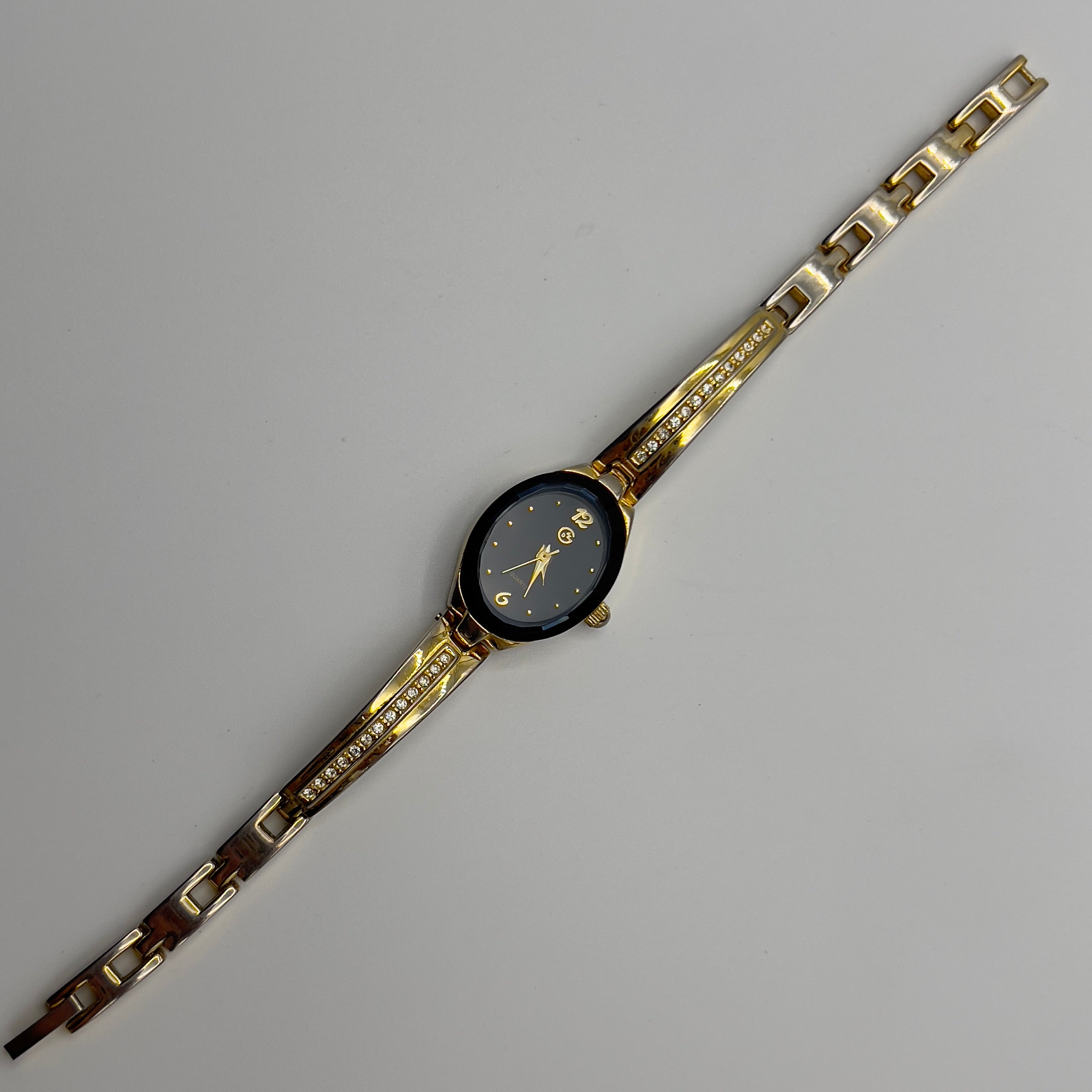 ✨ Gold-Toned Watch with Black Dial