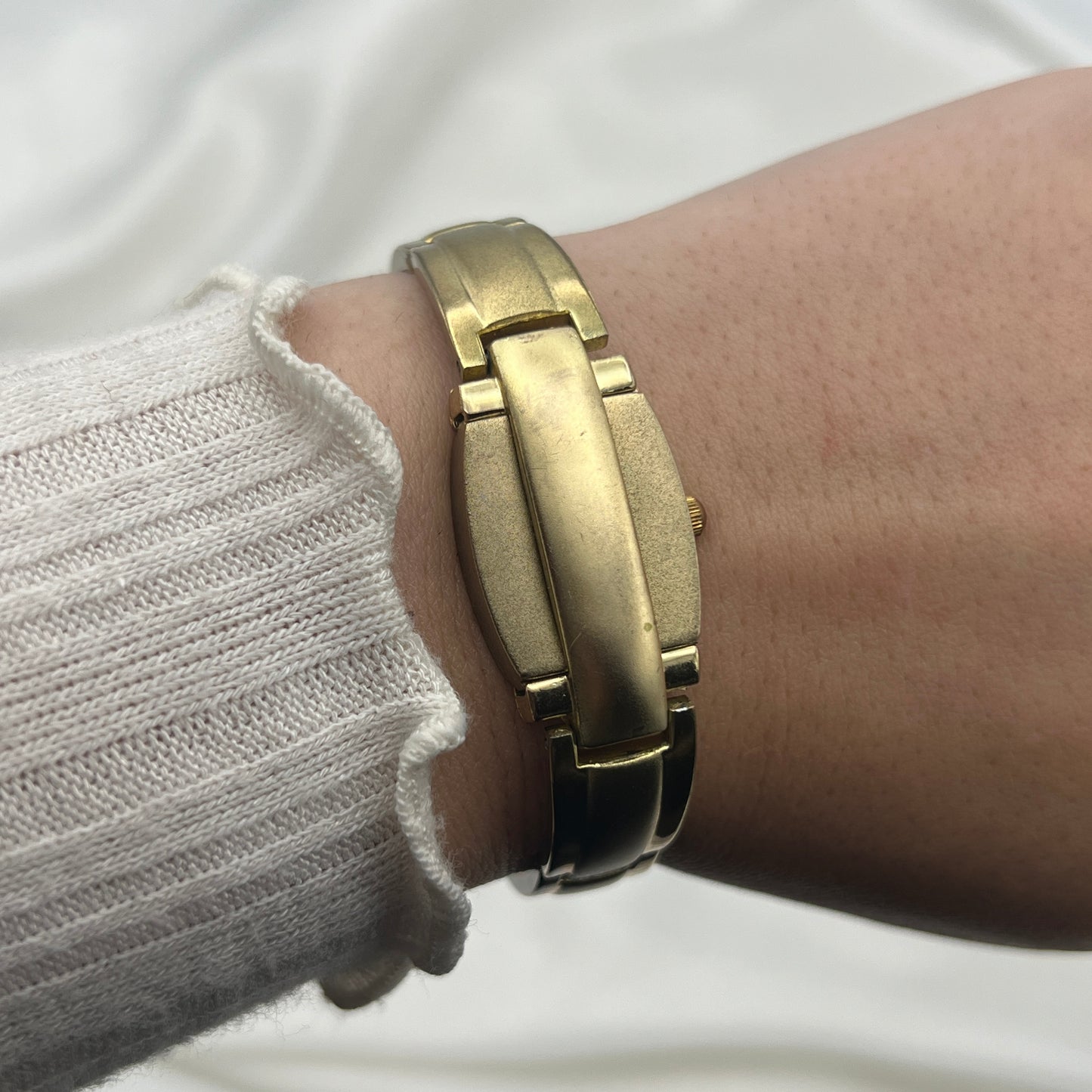 Gold Tone Peek a Boo Watch with Ruby Detailing
