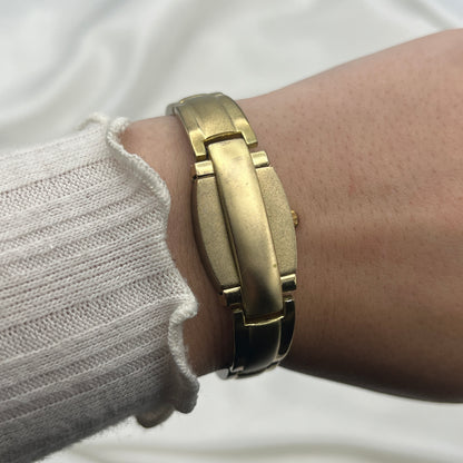 Gold Tone Peek a Boo Watch with Ruby Detailing