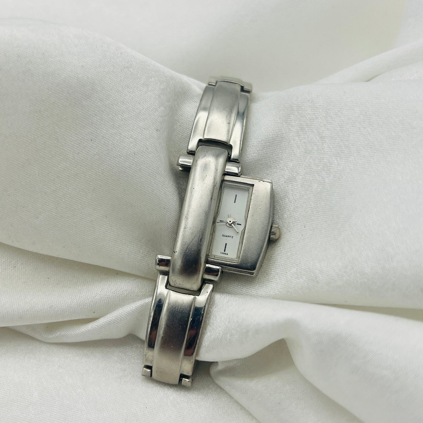 Silver-Toned Peek a Boo Watch