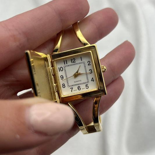 Gold-Toned Peek-a-boo Watch with White Stone