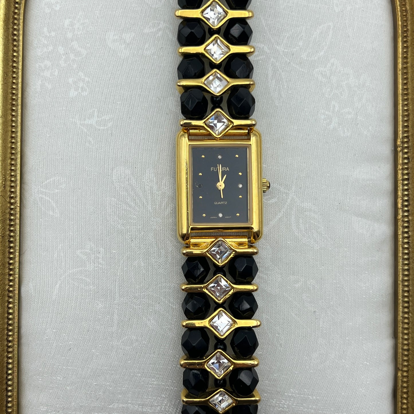 Gold-Toned Watch with Black Crystals