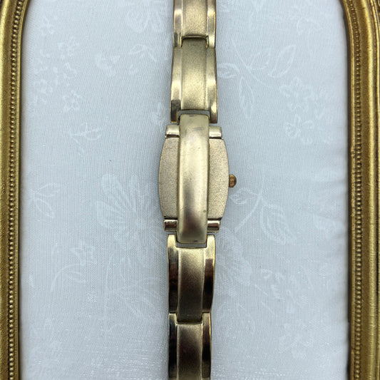 Gold Tone Peek a Boo Watch with Ruby Detailing