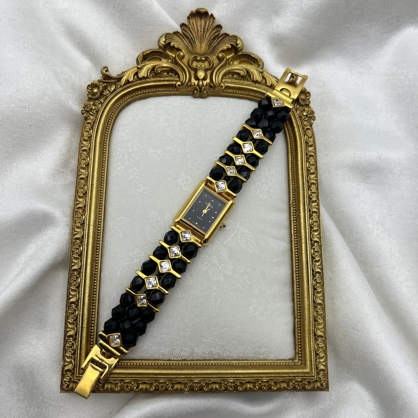 Gold-Toned Watch with Black Crystals