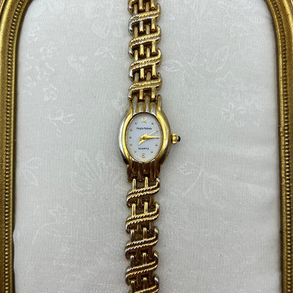Chic Gold-Toned Watch with Blue Gem Crown