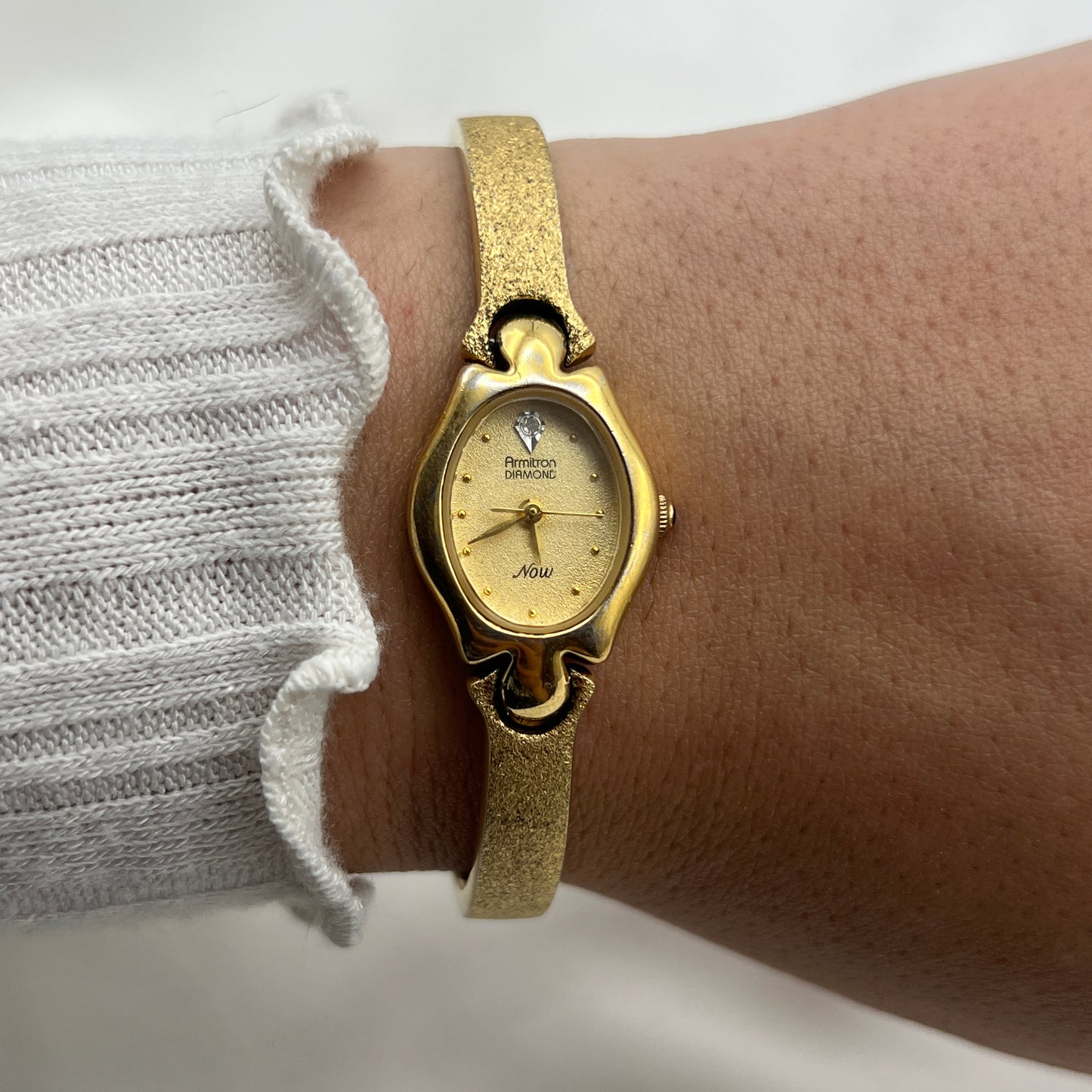 Armitron Diamond Brushed Gold-Tone Watch with Blue Jewel Crown