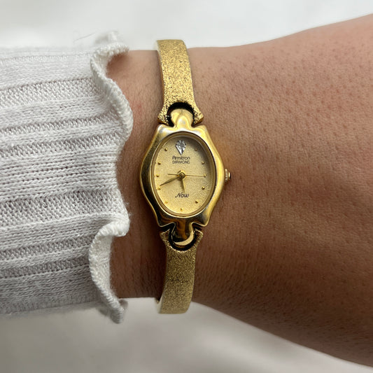 Armitron Diamond Brushed Gold-Tone Watch with Blue Jewel Crown