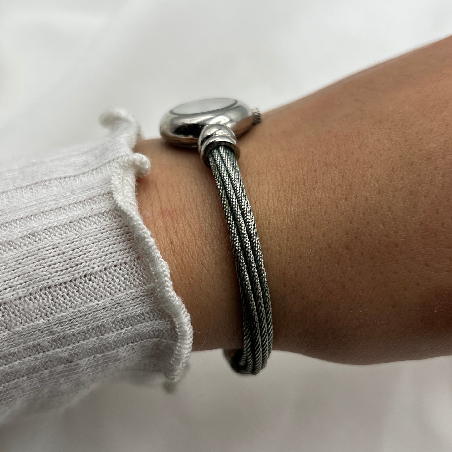 Twisted Silver-Tone Watch with Blue Gem Details