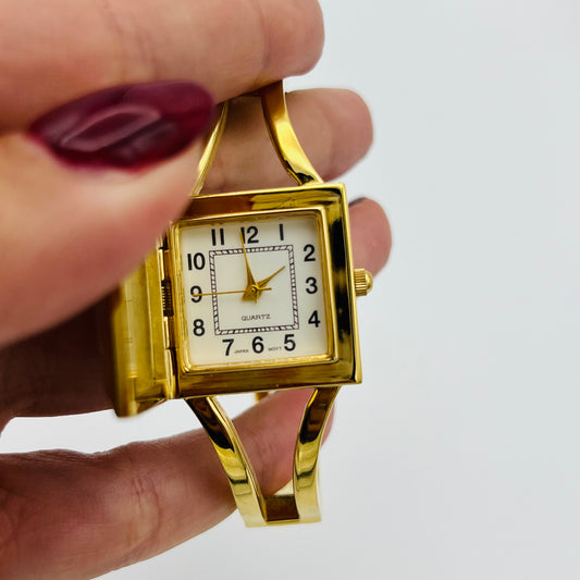 Gold-Toned Peek-a-boo Watch with White Stone