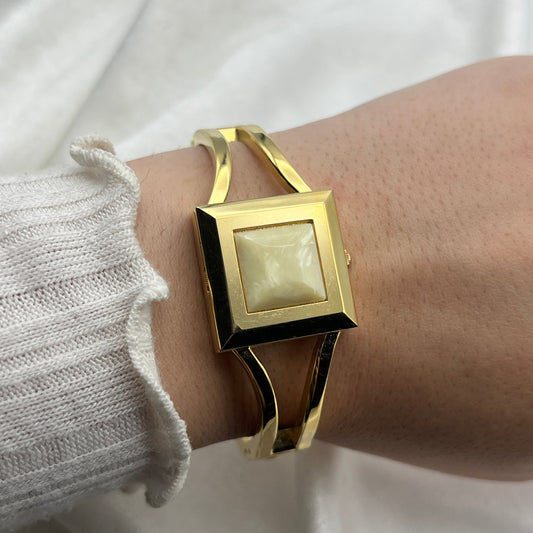 Gold-Toned Peek-a-boo Watch with White Stone